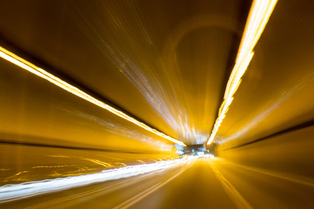abstract of car in tunnel with motion blur on the road. Driving Around Town. Long Exposure. A view...