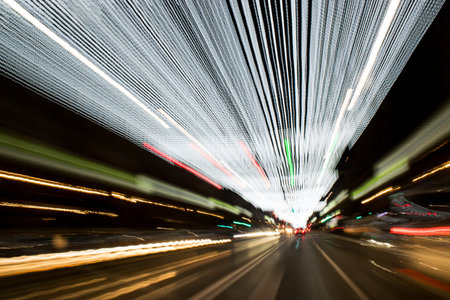 Car light trails on the road in the tunnel. Long exposure. Driving Around Town. Light Rain. Long...