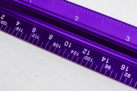 Beautiful violet ruler on a white desk
Purple ruler on white wooden background, close-up.の写真素材