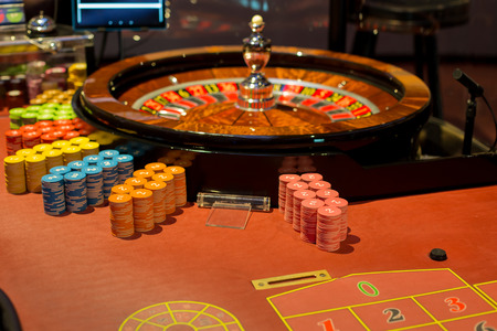 Gaming table in Casino with roulte and chips.のeditorial素材