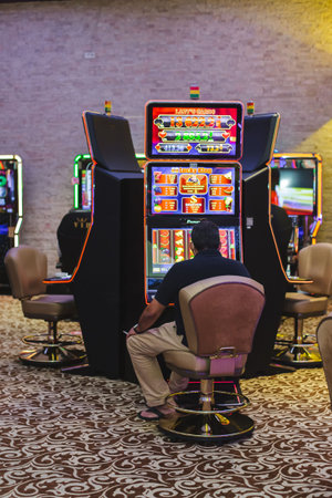 Slot machines in Las Vegas Downtown. Tourists at Casino.
