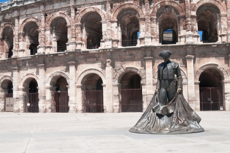 Matador statue outside the ancient Roman amphitheater in Nimes, Franceの写真素材