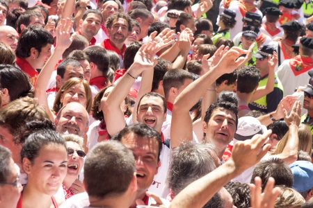 PAMPLONA, SPAIN -JULY 6: People are having fun at the opening of the San Fermin festival. Pamplona, Navarra, Spain 6 July 2011 in Pamplona Spain. のeditorial素材