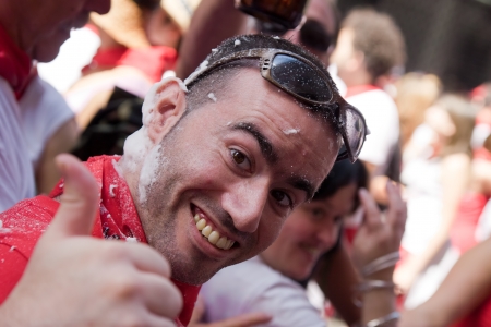 PAMPLONA, SPAIN -JULY 6  People are having fun at the opening of the San Fermin festival  Pamplona, Navarra, Spain 6 July 2011 in Pamplona Spain  のeditorial素材
