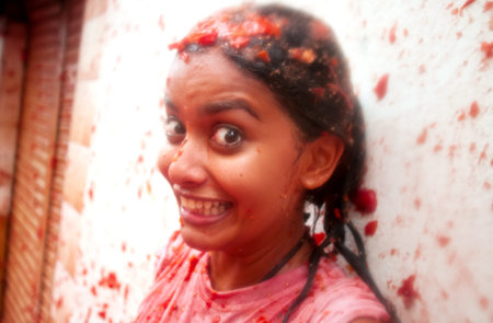 Bunol, Spain - August 28: The girl in crushed tomatoes laughs on Tomatina festival in Bunol, August 28, 2013 in Spainのeditorial素材