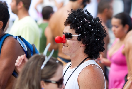 RIO DE JANEIRO - FEBRUARY 11: A fun dressed man on free people's carnival in Rio de Janeiro February 11, 2013, Brazil. Av. Vieira Souto along Ipanema Beachのeditorial素材