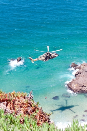 CAPE CABO DA ROCA, PORTUGAL - JULY 30  Military helicopter takes part in rescue operation at Cape Cabo da Roca, Portugal, July 30, 2013のeditorial素材