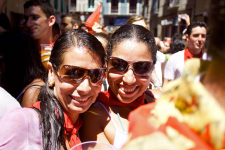 PAMPLONA, SPAIN-JULY 6: Two woman are posing at opening of San Fermin festival. Plaza Consistorial...