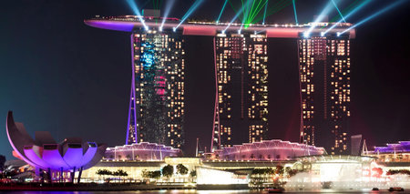 SINGAPORE - JANUARY 23: Marina Bay Sands hotel at night on January 23, 2014 in Singapore. Wonderful show is the largest light and water spectacle in Southeast Asiaのeditorial素材