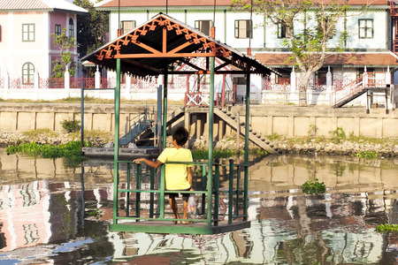 BANGKOK, - JANUARY 28: Little ropeway (platform) across river Chao Phraya in Bang Pa In Palace, Thailand January 28, 2014. Popular with tourists and locals.のeditorial素材