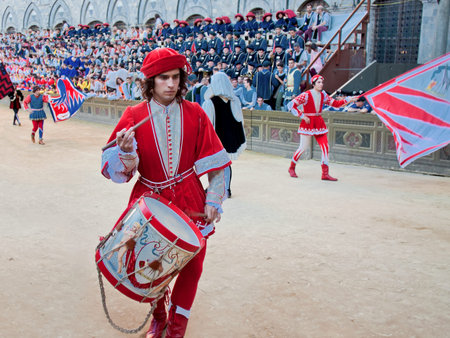 SIENA, ITALY - AUGUST 16: Parade before start of annual traditional Palio di Siena horse race in medieval square "Piazza del Campo" August 16, 2014 in Siena, Italy.のeditorial素材