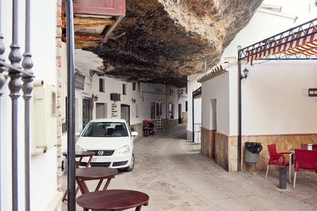 Street with dwellings built into rock overhangs above Rio Trejo. Setenil de las Bodegas, Spainのeditorial素材