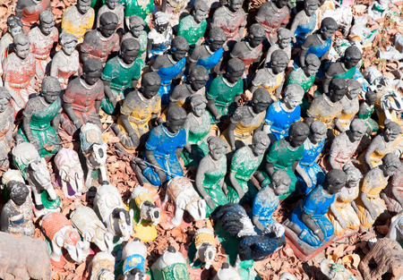 Small figures of people and animals near temple in Thailandのeditorial素材