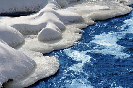 snow scene with rushing water