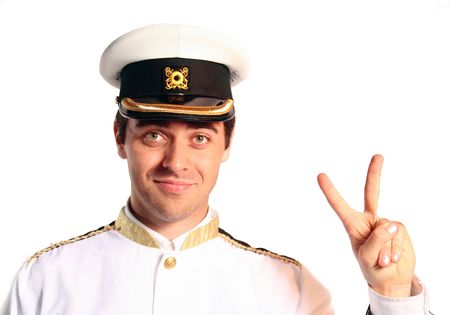 man in military sailer field uniform with hat salutingの写真素材