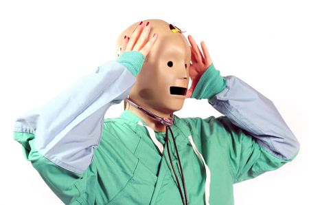 crash test dummy head on a medical worker in shock and frustration of fearの写真素材