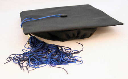 graduation ceremony gown cap or hat with blue tasselの写真素材