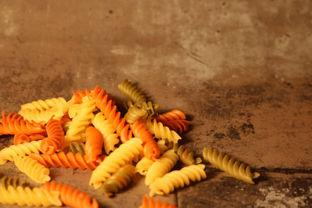Three-colored pasta on stone backgroundの写真素材