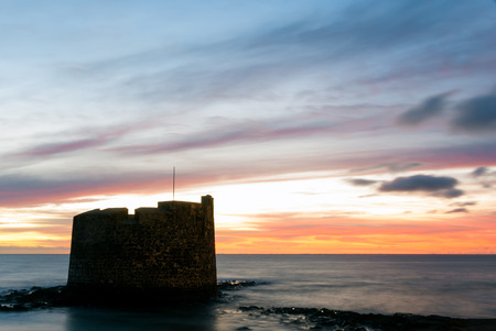 A shot of Saint Peter Martyr Tower (San Cristobal Castle) in Las Palmas de Gran Canaria at dawnのeditorial素材