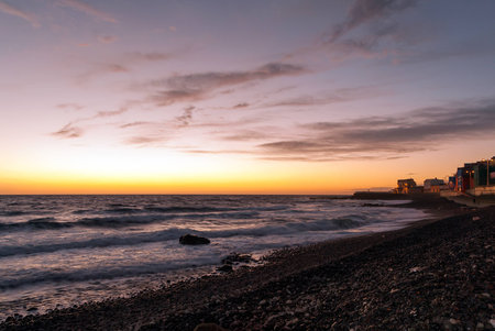 A shot of the sunrise from a rocky beach