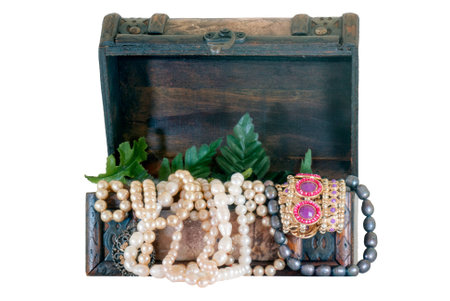 A shot of an old wooden chest full of jewerlyの写真素材
