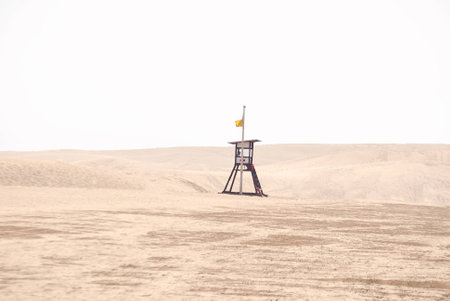 A shot of a lifeguard in the beach and  nature reserve Dunes of Maspalomas in Grand Canary islandの写真素材