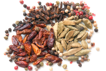 A macro species beans composition of different colors and textures (cardamom, pepper, cloves, chillies and cinnamon)の写真素材