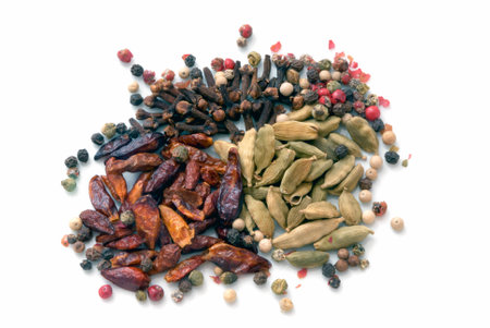 A macro species beans composition of different colors and textures (cardamom, pepper, cloves, chillies and cinnamon)の写真素材