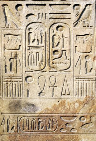 Egyptian hieroglyphs at stone bas-reliefの写真素材