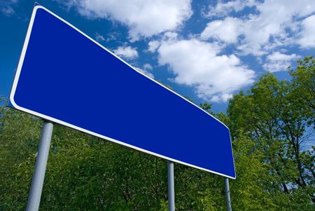 Blank road index and green summer treesの写真素材