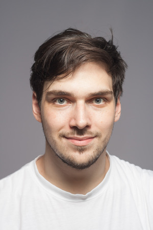 Happy young Caucasian man portrait.の写真素材