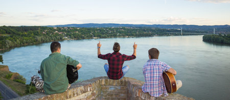 Thee man band rear view panorama riverの写真素材