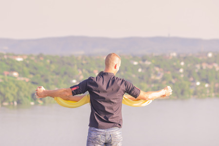 young couple man holding woman hands back rear viewの写真素材