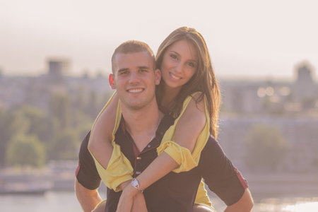 close up young couple front view girl woman boy man back smiling happy sunny day