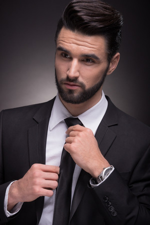 young man handsome elegant suit closeup, head shoulders, necktie knot closeup head faceの写真素材