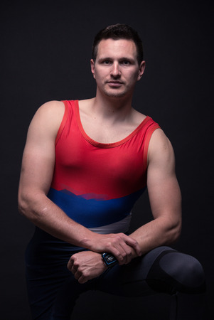 one young adult man posing, upper body, kayak canoe sportsman strong muscular, black background, sports clothingの写真素材
