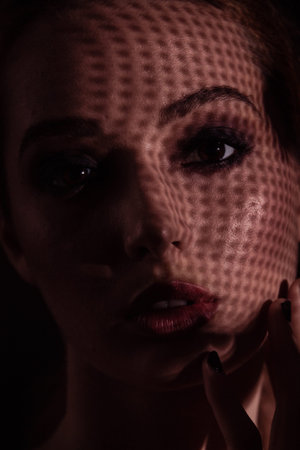 Close up portrait of dissapointed and sad young women. Night mood.