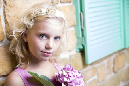 Beautiful girl with a flowerの写真素材