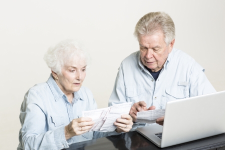Senior couple is concerned with billsの写真素材