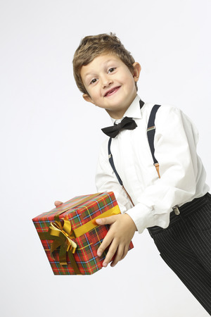 Boy excited with a giftの写真素材