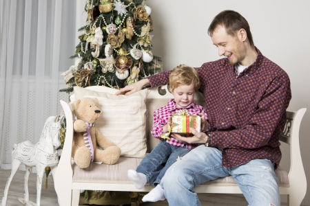 Father gives his son Christmas giftの写真素材