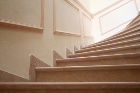 Stylish staircase with marble steps and stuccoの写真素材