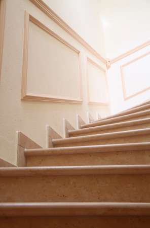 Stylish staircase with marble steps and stuccoの写真素材