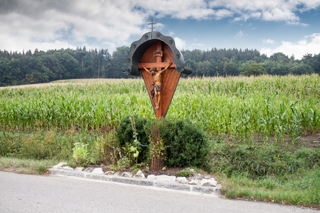A wooden wayside cross - wayside cross in Rehling and Aindling in Bavaria - Germanyの写真素材