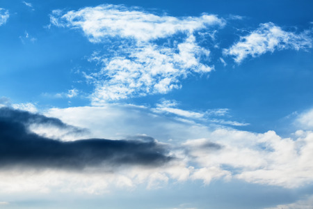 Turbulent perspectives - Dramatic clouds sky dark clouds and bright blueの写真素材