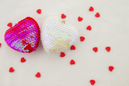 Valentines day time! Pink and white heart with tiny red hearts isolated on a white background. Close up. Top view.の写真素材