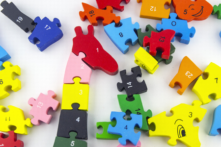 Time to play. Children's wooden toys, colorful puzzles with white backgroundの写真素材