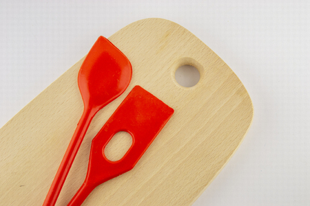 Accessories for kitchen on wooden board and with white backgroundの写真素材