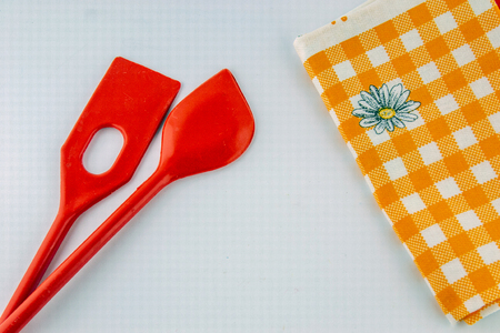 Accessories for kitchen on wooden board and with white backgroundの写真素材