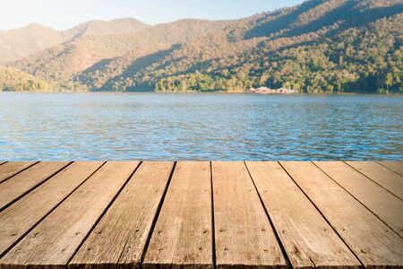 Empty wooden table top with the lake landscapeの写真素材